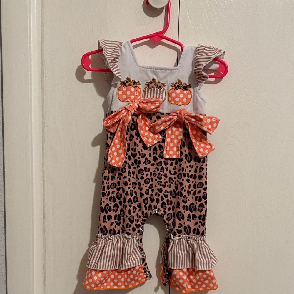 Boutique 9 Kids Romper with Leopard and Orange Bow Accents